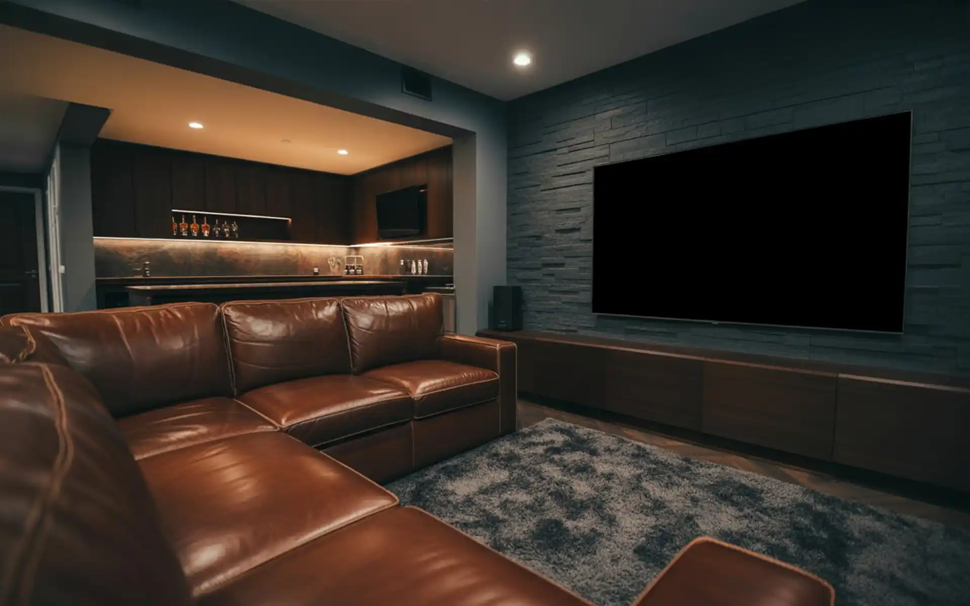 Cozy rustic man cave with reclaimed wood walls and an electric fireplace.
