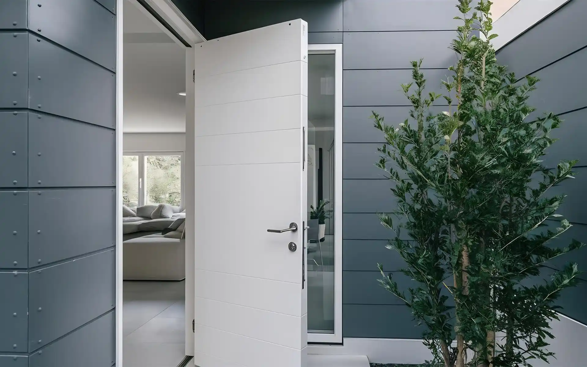 White sliding barn door saving space between a bedroom and living area