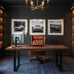 A luxurious man cave office with dark charcoal walls, a leather executive chair, and built-in bookshelves.