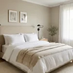 A luxurious small bedroom with light oak accents, white bedding, and soft natural light.
