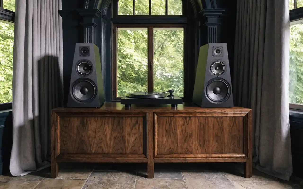 A minimalist audio nook with a high-end turntable and record storage in a moody room.