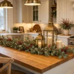 Flat lay of finished Christmas Cricut decor projects including vinyl ornaments, paper snowflake garland, farmhouse sign, and gift tags