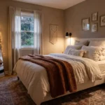 A highly aesthetic, cozy small bedroom with layered chunky knit bedding, warm fairy lights, and an earthy color palette.
