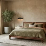 Luxurious earthy modern bedroom featuring limewash walls, a walnut platform bed, and rich olive linen bedding.