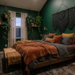 Luxurious moody boho bedroom featuring dark emerald walls, a warm wood platform bed, and layered vintage rugs.