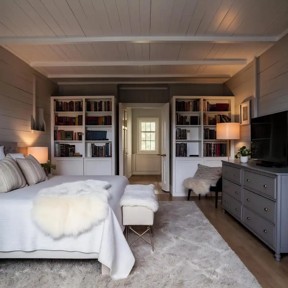 Queen bed floated in the center of a small apartment bedroom with 24-inch clearance on both sides and cream linen bedding