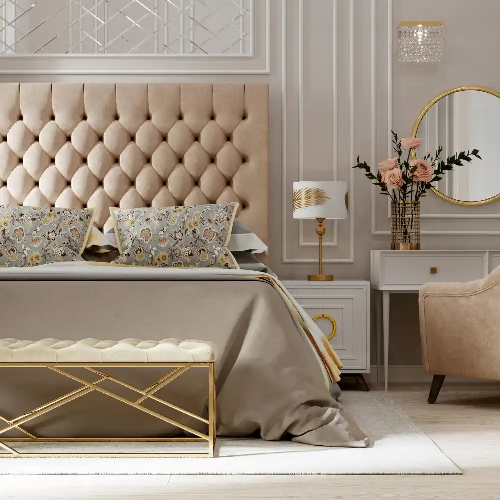 Blush and cream teen bedroom with a curved boucle headboard, gold framed mirror, and antique brass wall sconce
