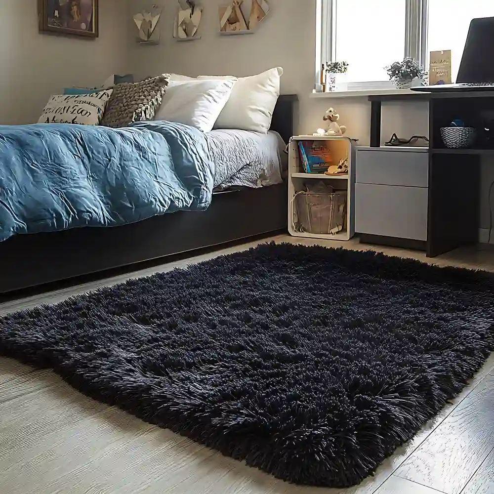 Dorm room with a flat-weave jute rug under the bed with front legs resting on it to anchor the sleeping zone