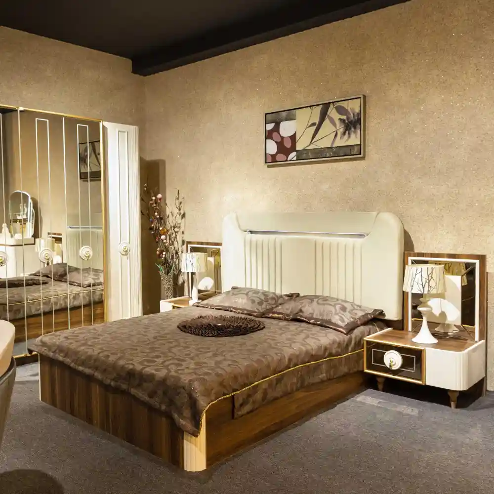 Earthy terracotta modern teen bedroom with a low oak platform bed, washed linen bedding, rattan reading chair, and ceramic lamp