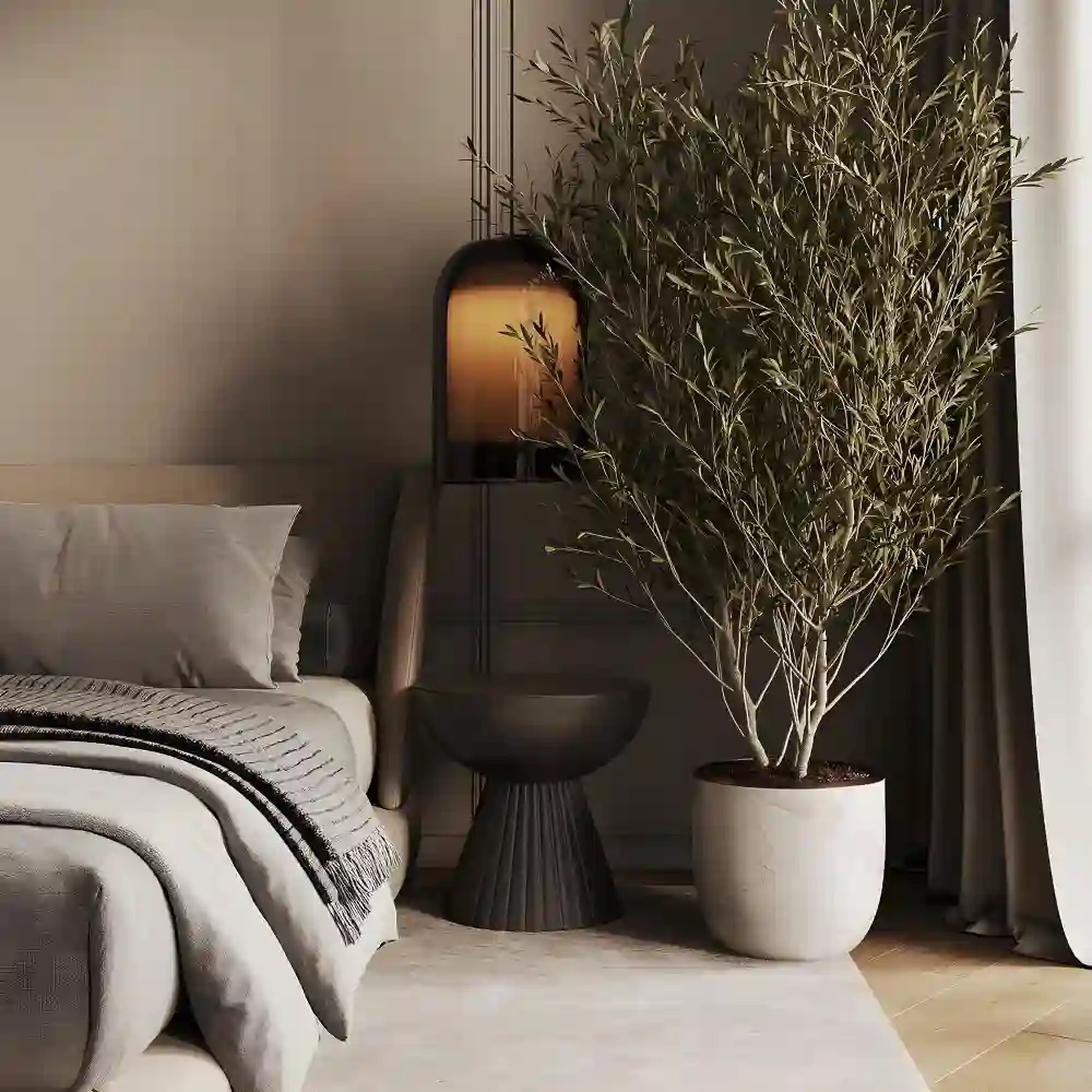 Minimal japandi bedroom styling with a bare wall, a clear nightstand, and a single ceramic vase