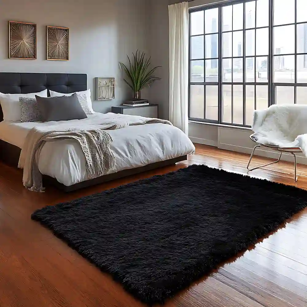 Large area rug running under the lower two-thirds of a bed and extending past both sides