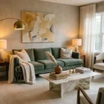 Luxurious living room with sage velvet sofa, brass arc lamp, marble coffee table, and layered warm textiles