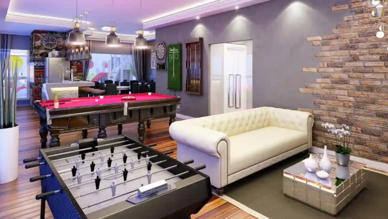 Fully finished man cave with leather sofa, matte black shelving, mini fridge, and warm ambient lighting