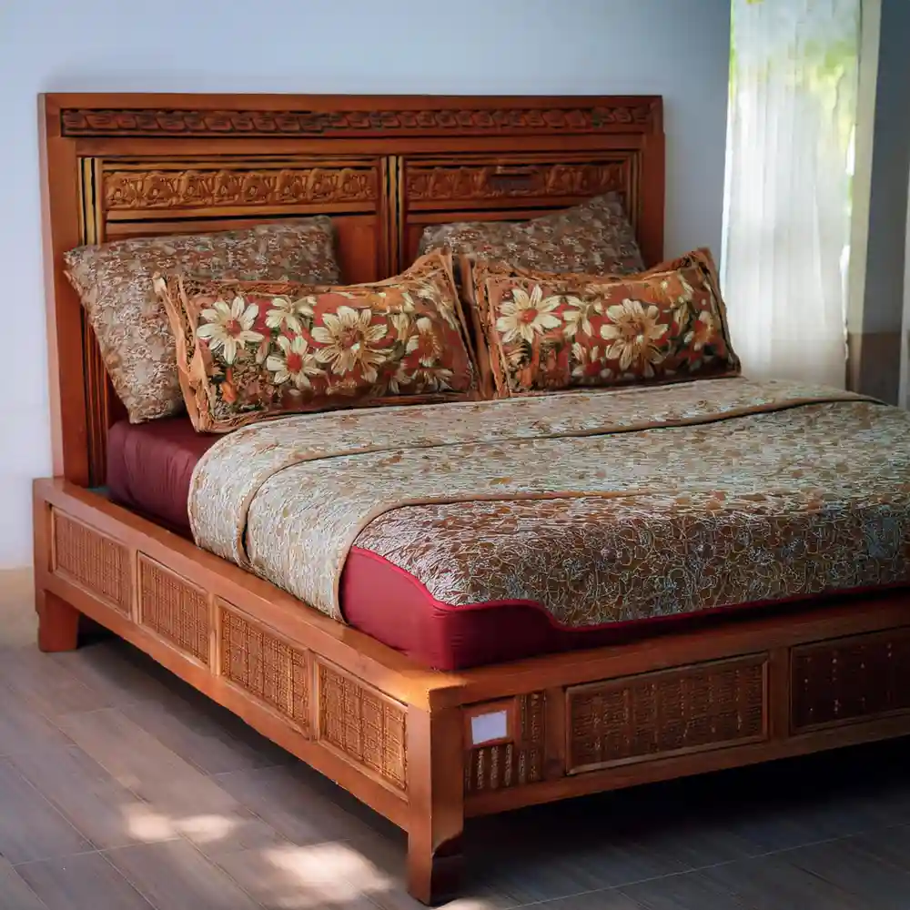 Low-profile walnut platform bed with clean lines and tapered legs in a warm mid-century modern bedroom