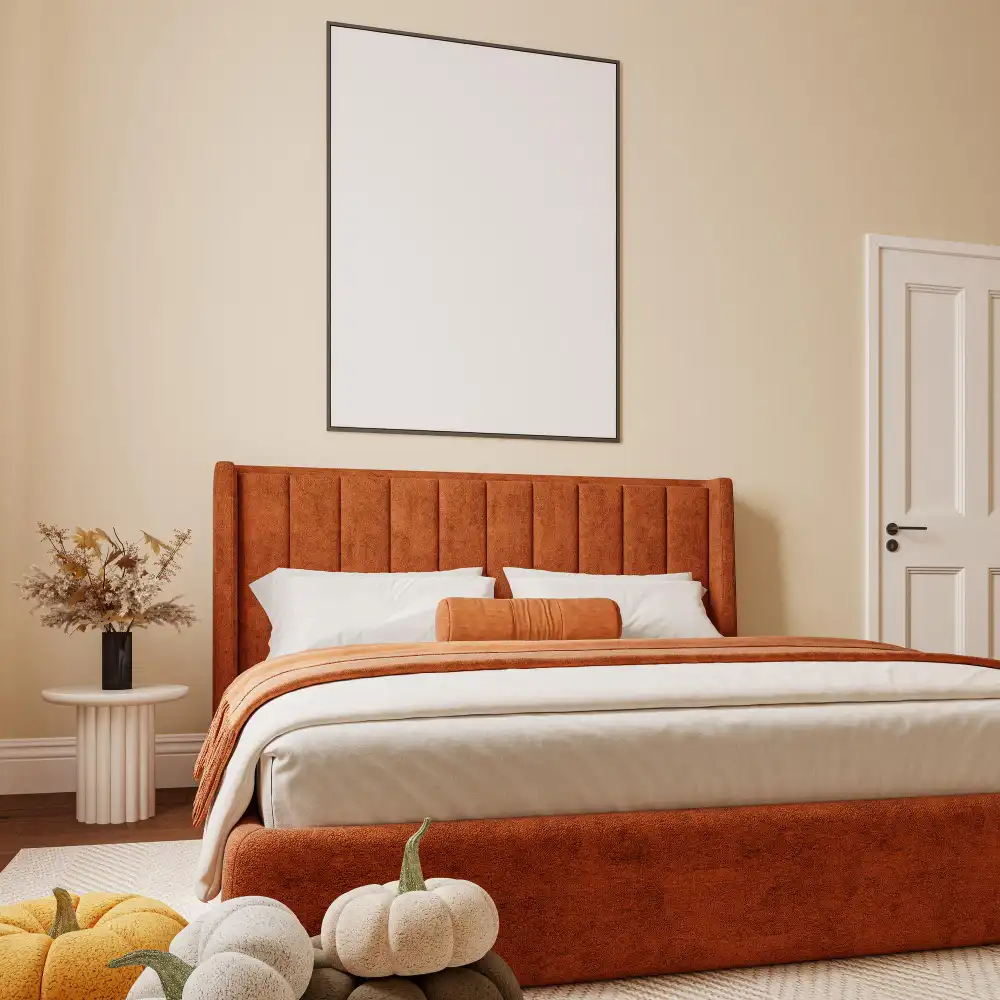 Bedroom with warm walnut bed frame against soft warm white walls and layered cream linen bedding