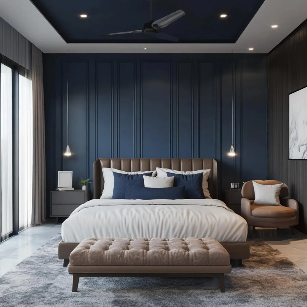 Navy blue and cream bedroom with cream walls, navy duvet, brass nightstand lamp, and layered linen bedding