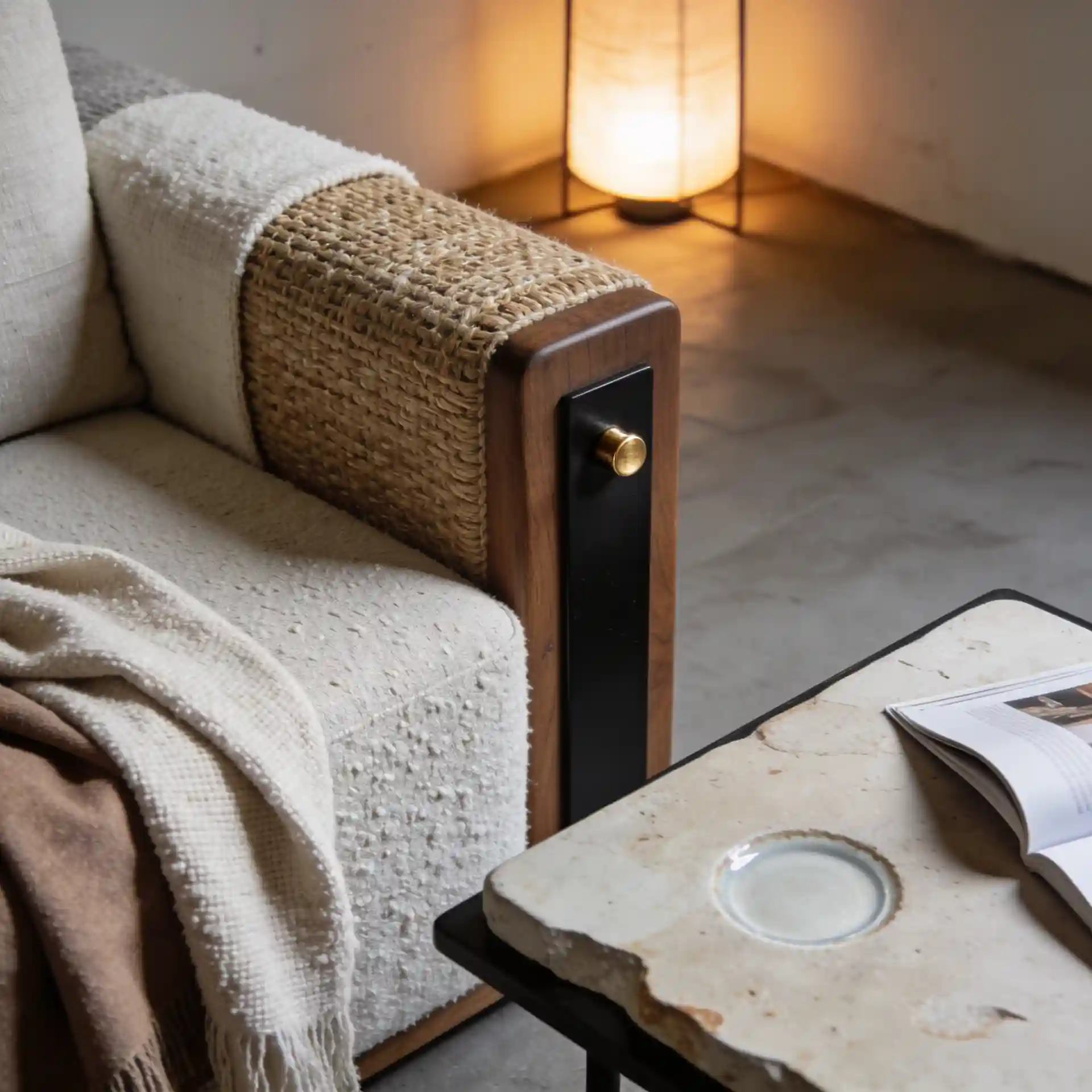 Close-up of wool, jute, linen, boucle, travertine, and clay textures on an organic modern coffee table