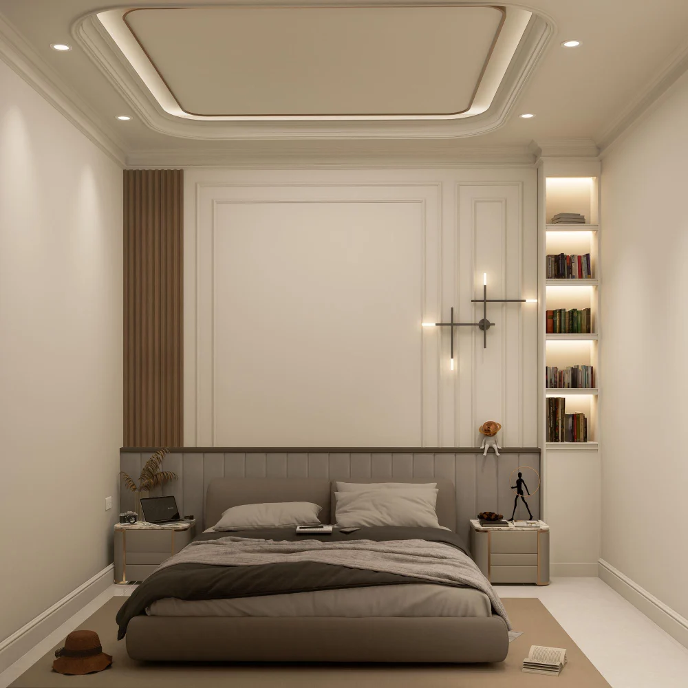 Studio sleeping zone with soft mushroom-toned accent wall behind the headboard, calmer than the warm greige living side