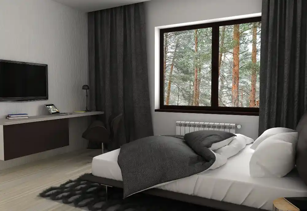 Airy small bedroom with high-LRV white walls, sheer curtains, and a large mirror reflecting window light