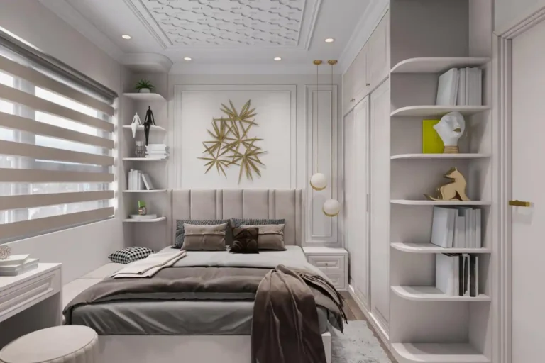 Bright small bedroom with a centered bed on the longest wall, tall slim dresser, wall shelves, and a soft greige palette