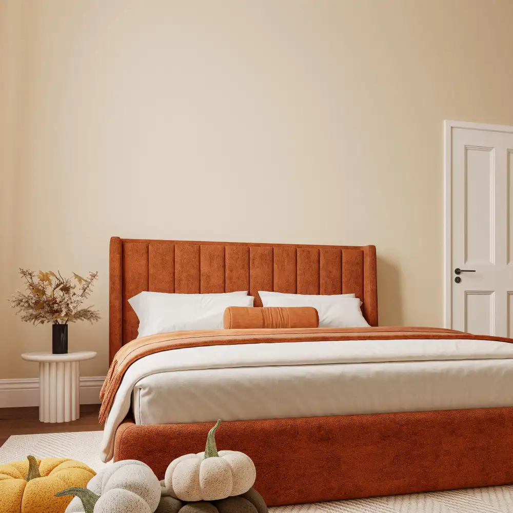 Bedroom wrapped in warm greige paint with cream and oat bedding and brass accents