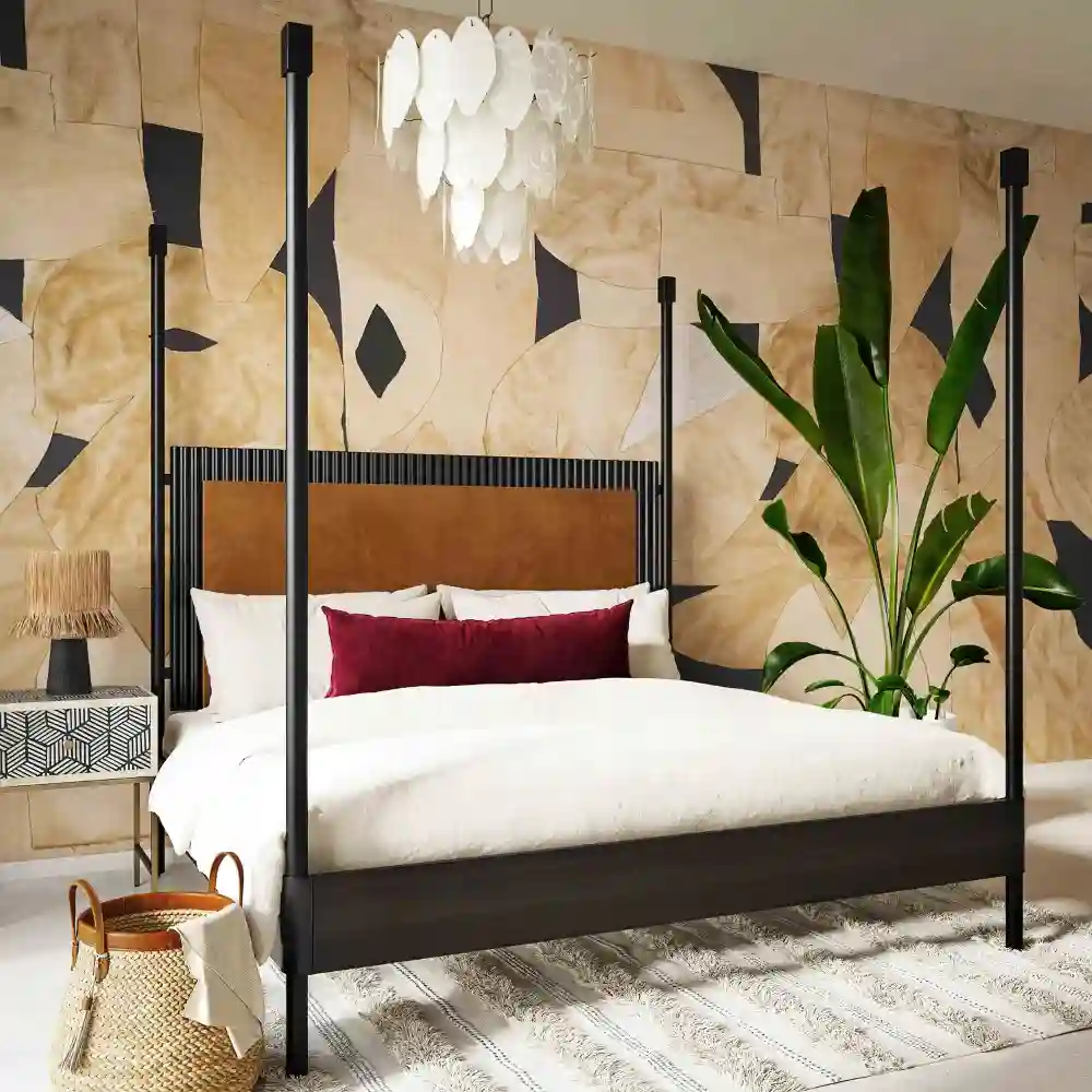 Modern farmhouse bedroom ideas with a warm white shiplap accent wall, upholstered headboard, and twin sconces
