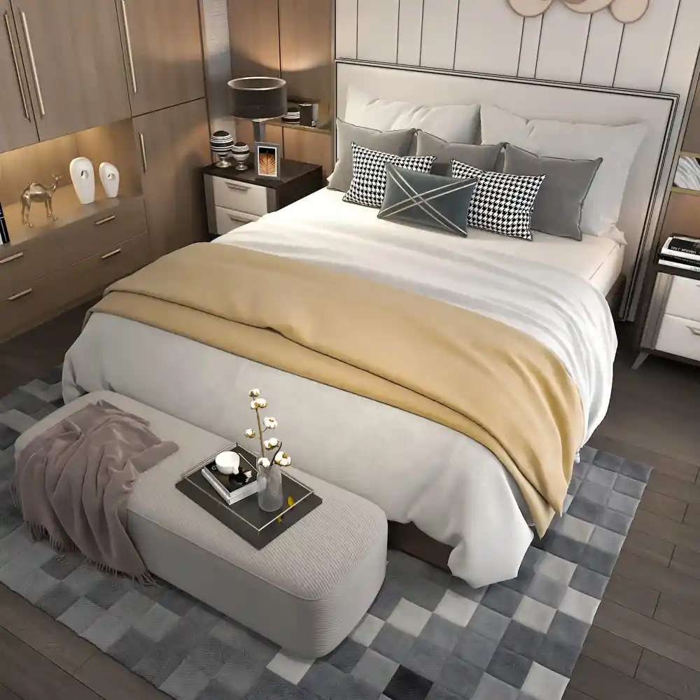 Low platform bed with glossy white headboard, holographic duvet, and pastel and gingham pillows