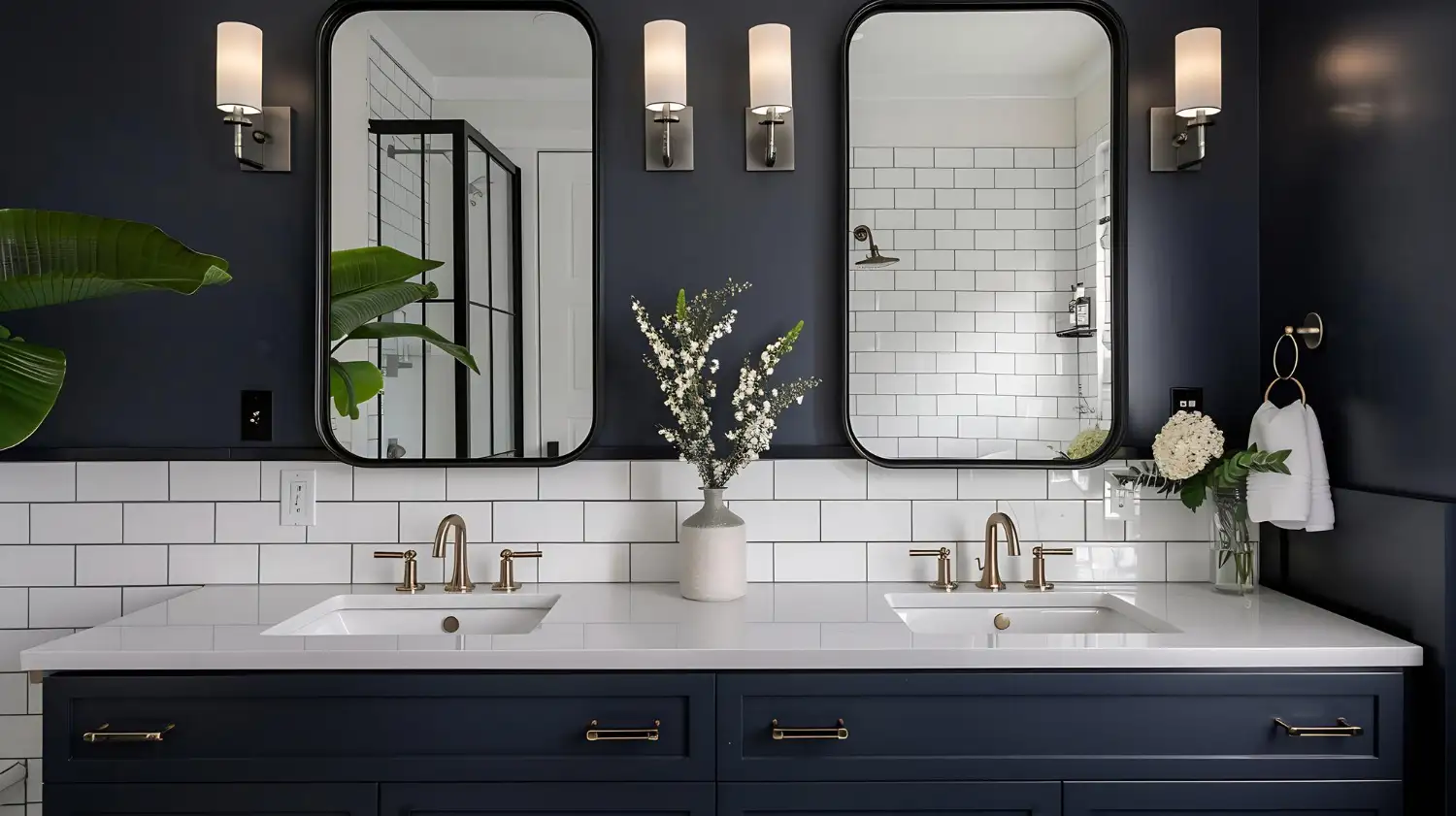 Freshly styled bathroom with warm greige walls, brushed brass fixtures, and layered cream textiles