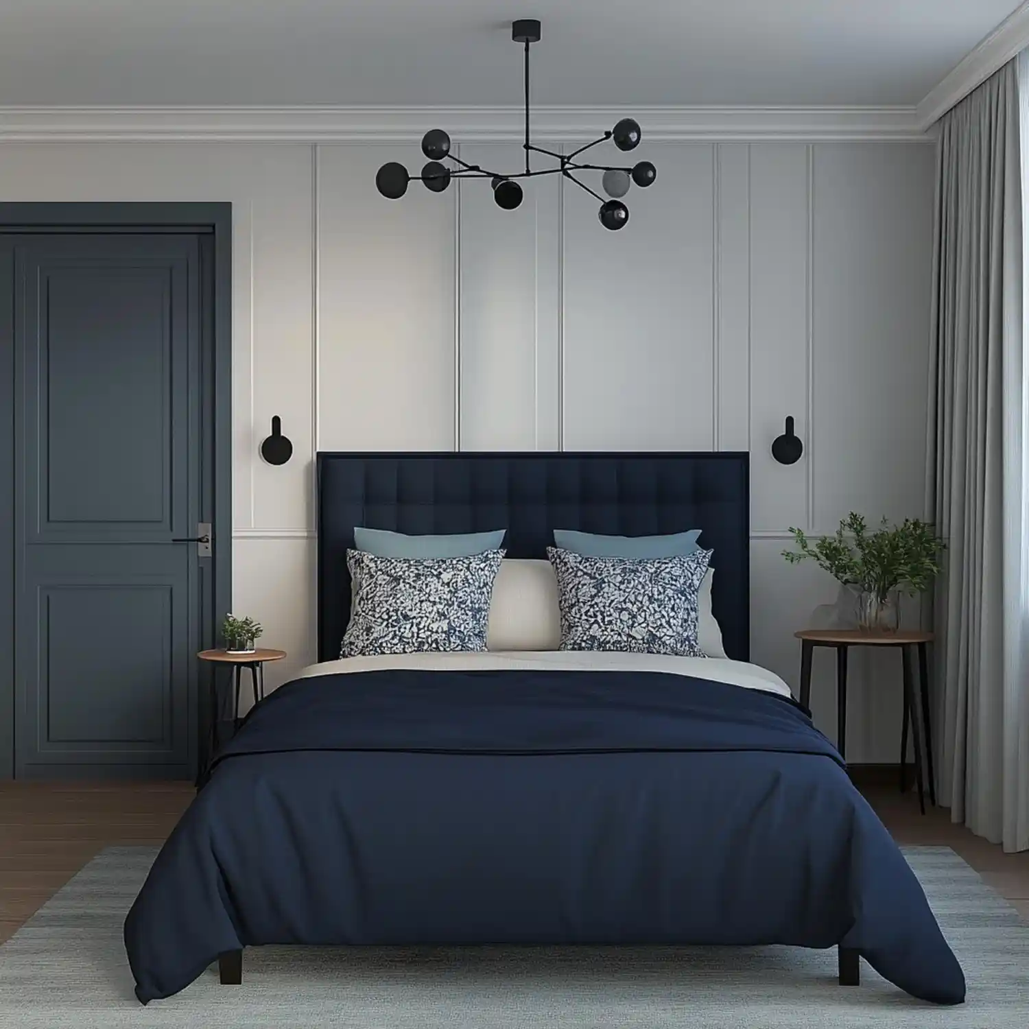 Dusty blue headboard wall with warm cream on three sides, oak furniture, and layered cream linen bedding