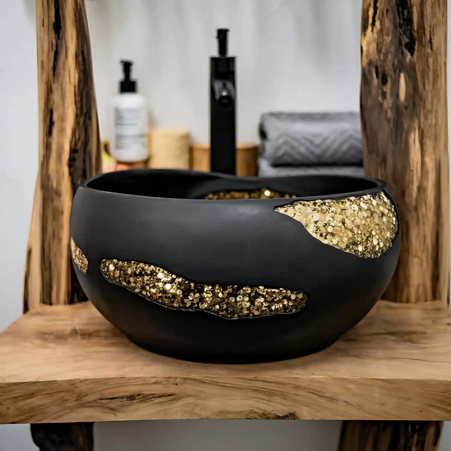Hands arranging a wood tray on a bathroom vanity with candle, soap, and a single stem
