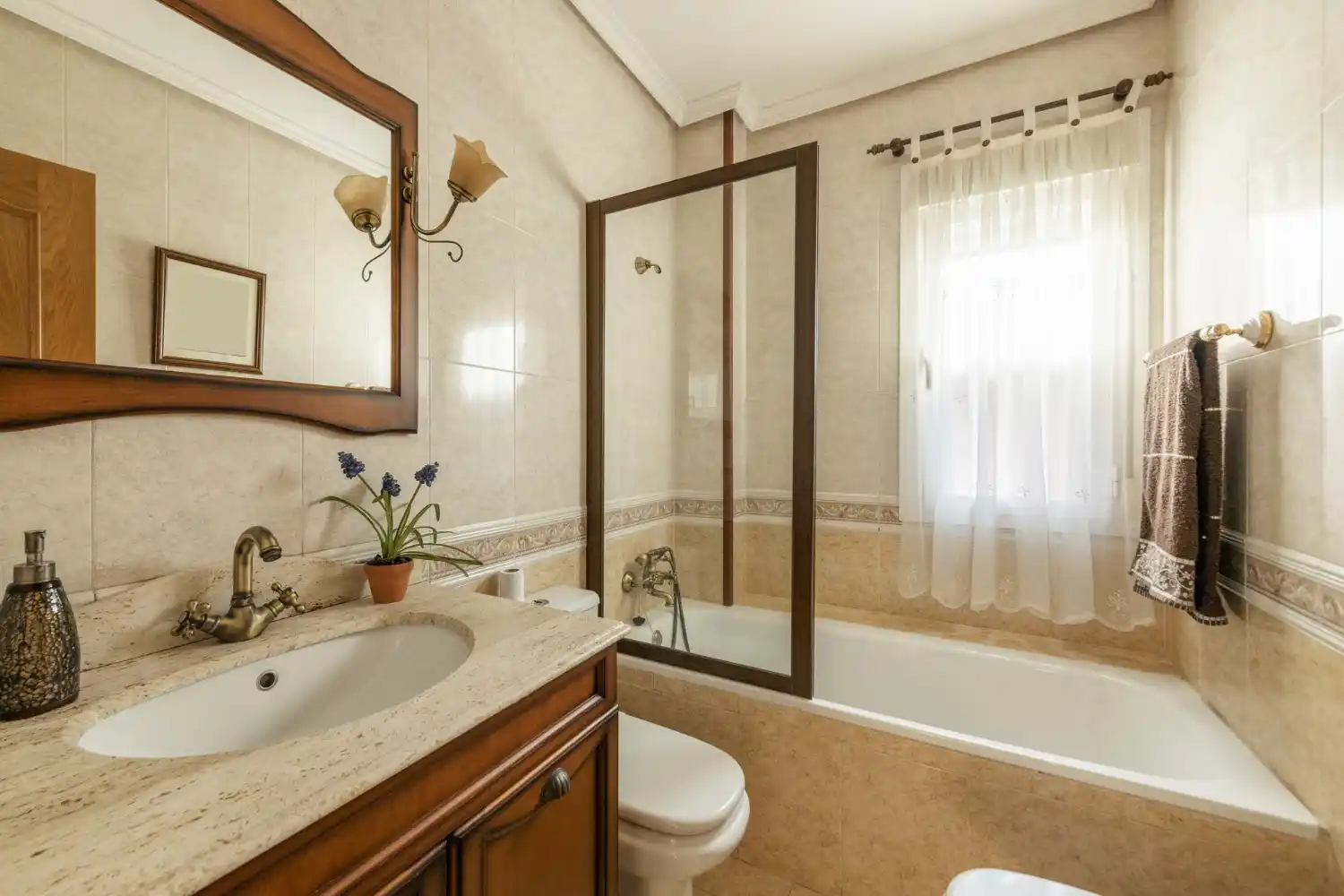 White oak farmhouse vanity with visible grain, shaker fronts, and a warm natural finish