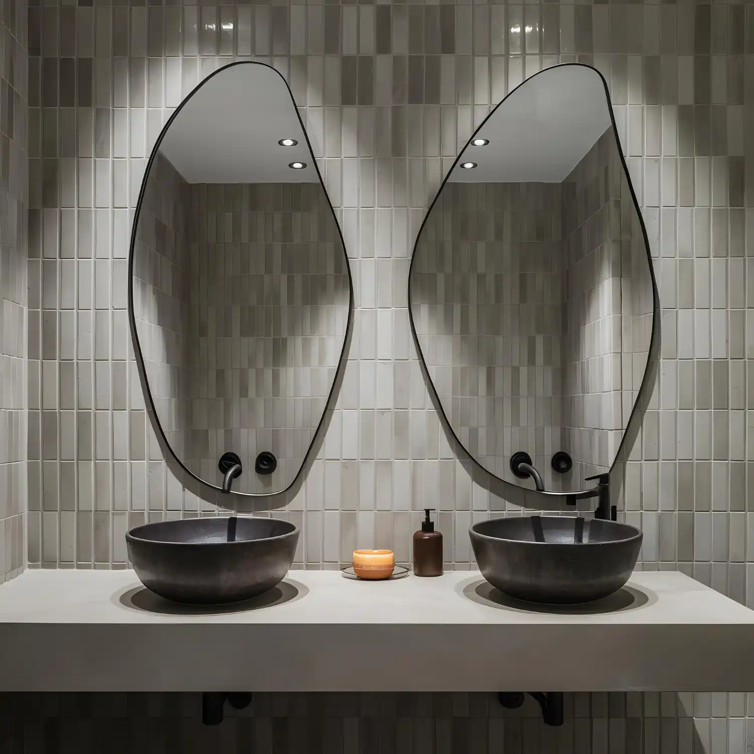 Side-by-side of a plain frameless rectangle mirror and a framed brass mirror over matching vanities
