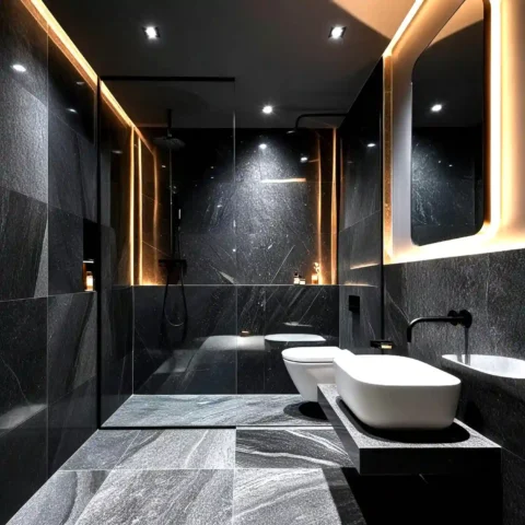 Marble shower wall with soft grey veining and a brushed brass shower head