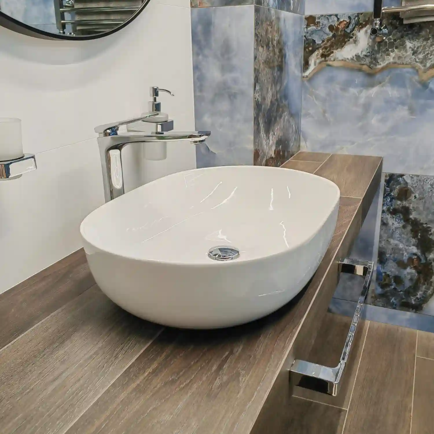 Warm modern farmhouse bathroom with white oak vanity, warm white walls, matte black faucet, and a single shiplap wall