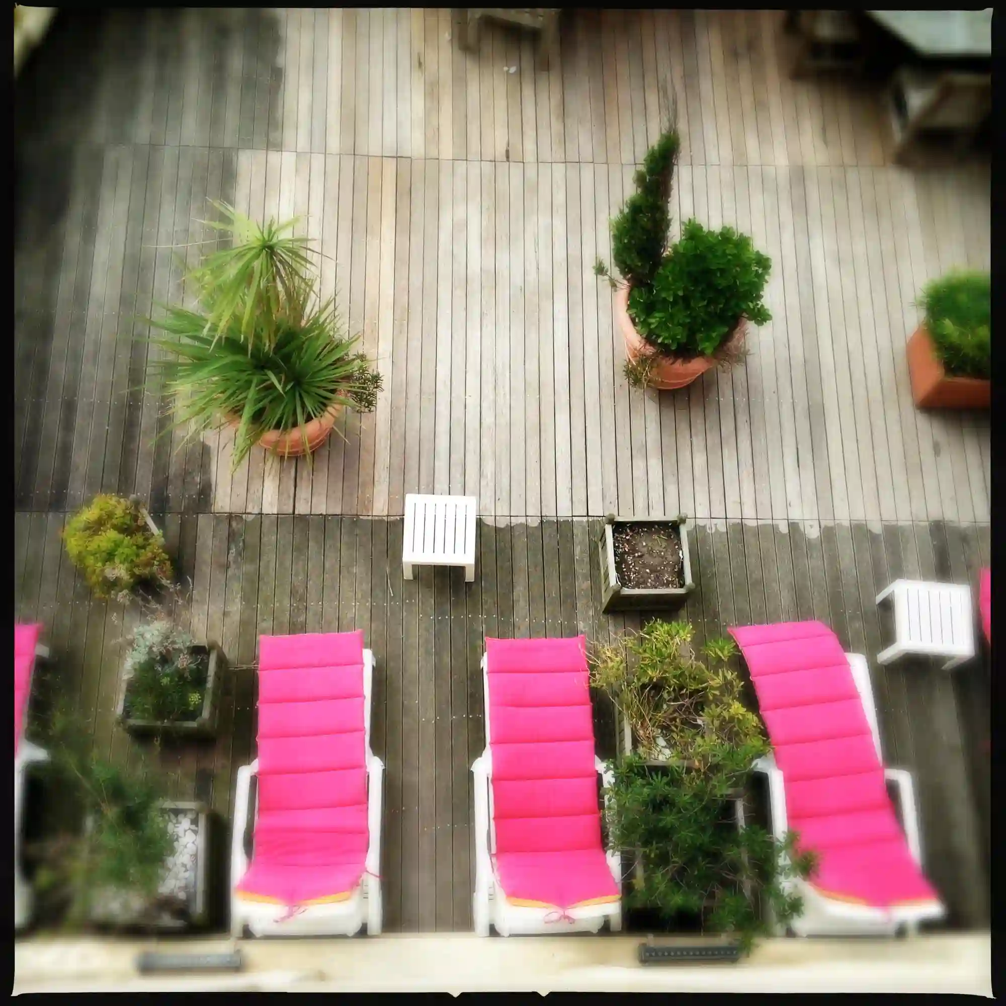 Patio planning scene with yard sketch, sun notes, furniture samples, tape measure, and exterior material swatches
