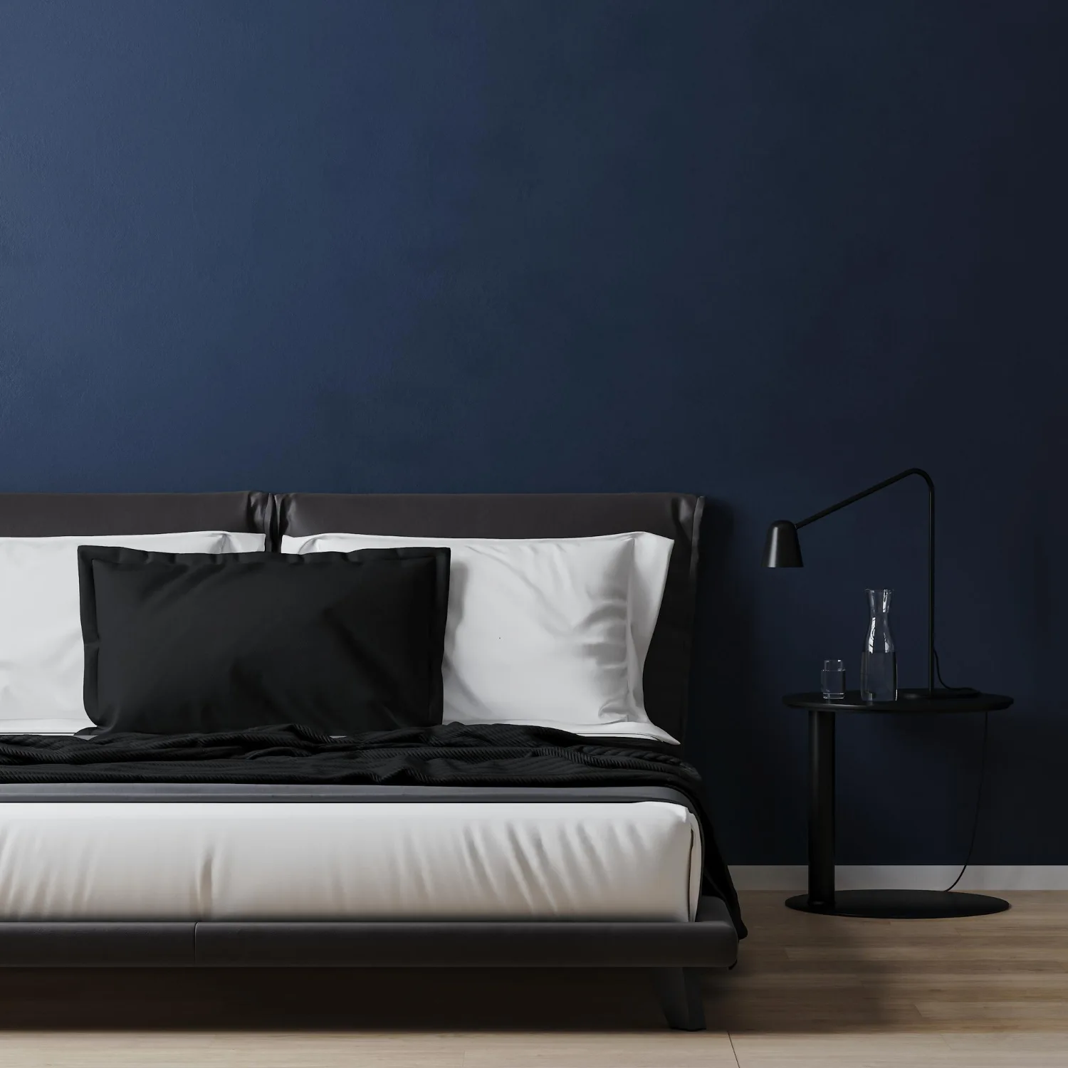 Spare bedroom converted to man cave with dark navy accent wall, floating oak shelves, framed jerseys, and leather armchairs
