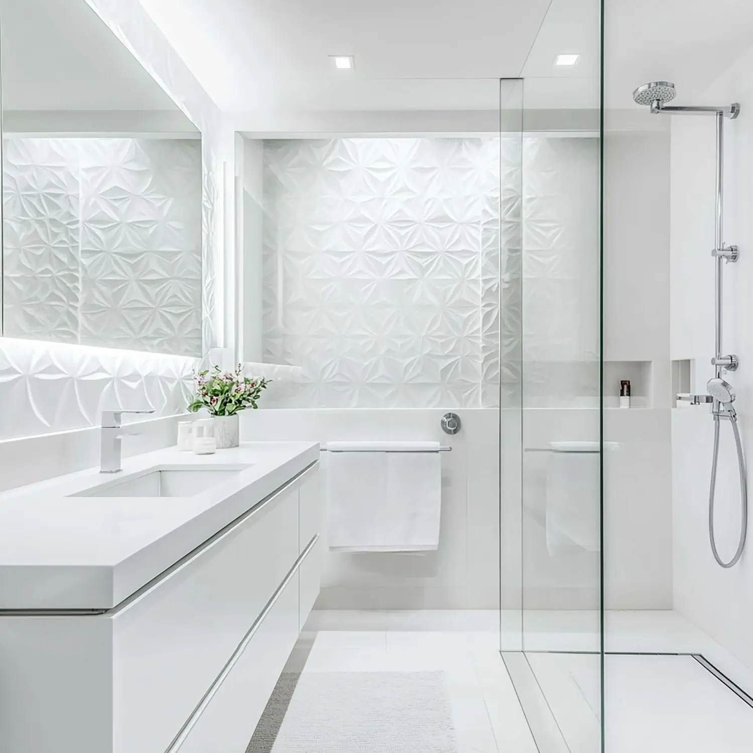 Bright all-white bathroom with cool lighting compared to a warmer layered white version