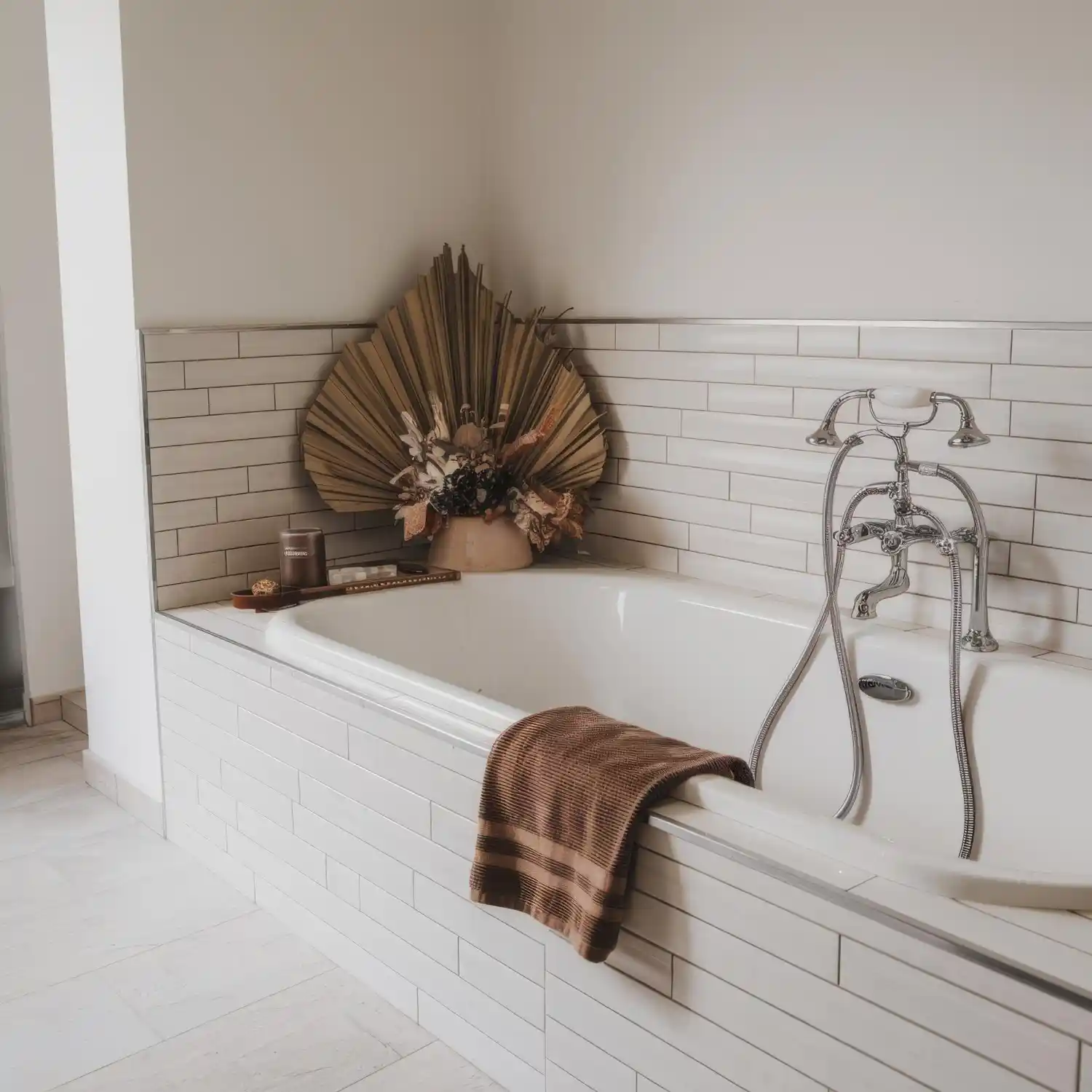 Warm, layered white bathroom ideas with oak vanity, brass faucet, and soft natural light